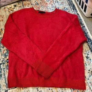 Red sweater with a furry texture